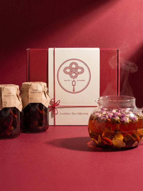 The Lactation Tea Collection box with rose and longan tea jars and a glass teapot of freshly brewed tea