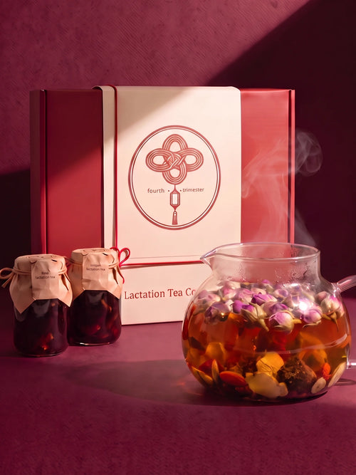 The Lactation Tea Collection box with rose and longan tea jars and a glass teapot of freshly brewed tea